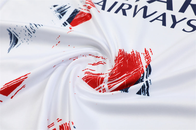 a close up of a white fabric with red and blue designs