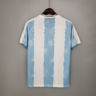 a blue and white t - shirt hanging on a hanger