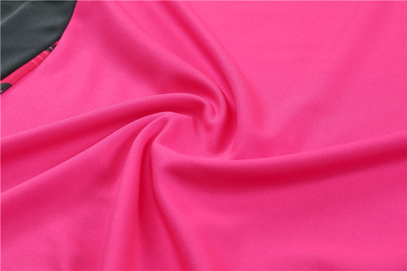 a close up of a pink and black fabric