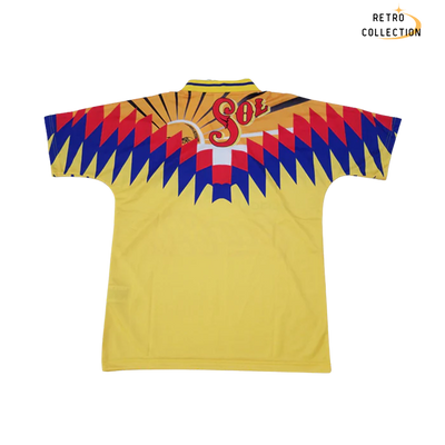 a yellow shirt with a red, blue and yellow design