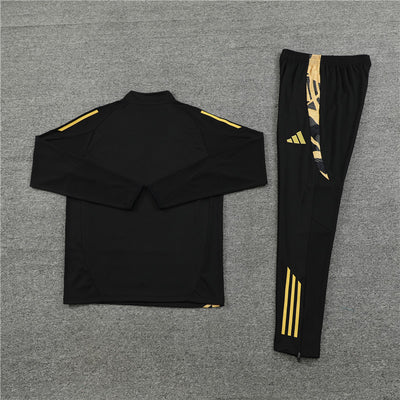 a black and gold tracksuit with matching pants