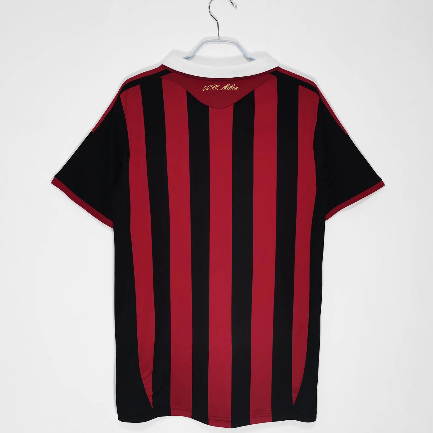 a black and red striped shirt hanging on a hanger