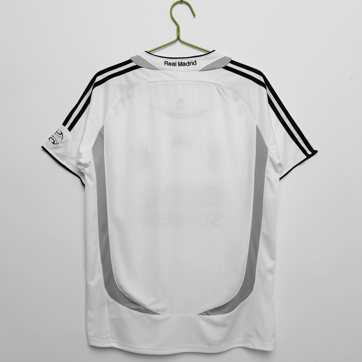 a soccer jersey hanging on a hanger