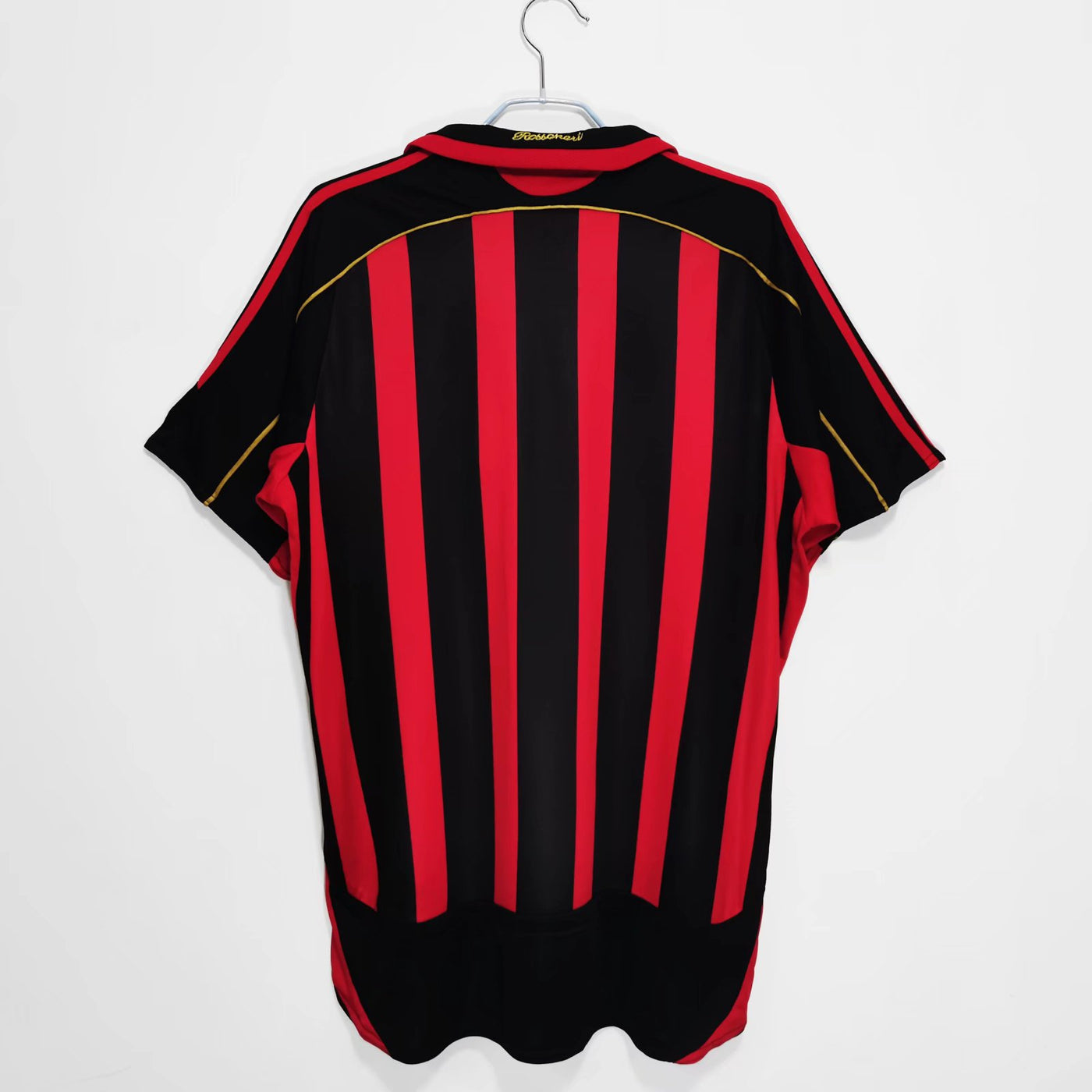 a black and red striped shirt hanging on a hanger