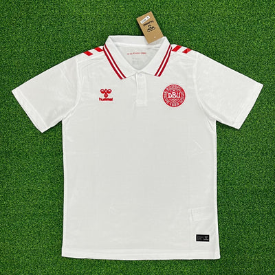 a white polo shirt with a red stripe on the collar