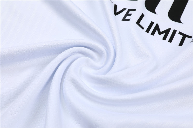 a white shirt with a black and white logo on it