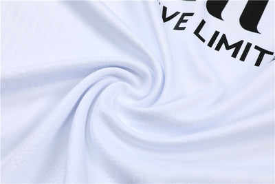 a white shirt with a black and white logo on it