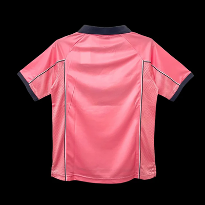 a pink soccer jersey with black piping on the chest