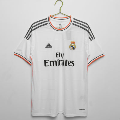 a soccer jersey hanging on a hanger