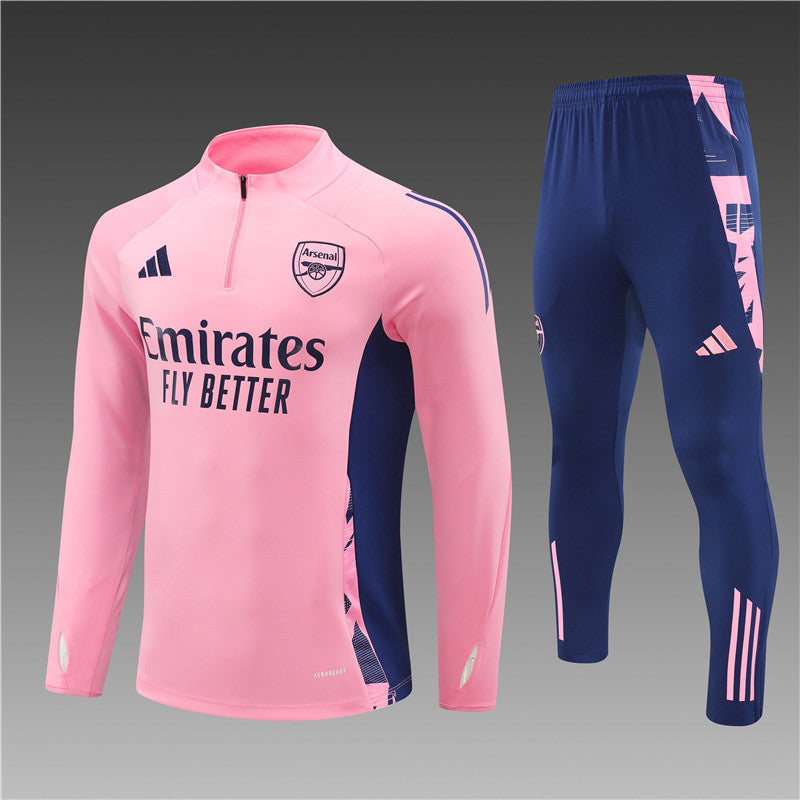 a pink and blue soccer jersey and pants