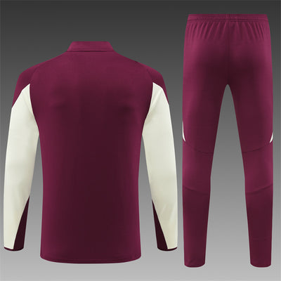 a maroon and white soccer uniform with white sleeves