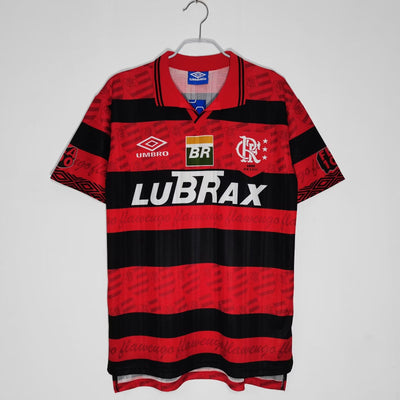 a red and black rugby shirt hanging on a hanger