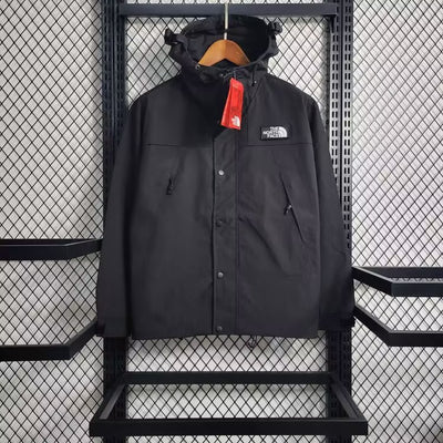 the north face jacket hanging on a rack