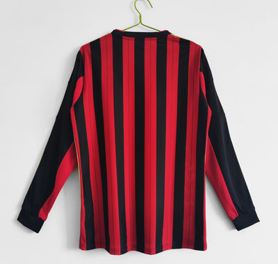 a black and red striped shirt hanging on a hanger