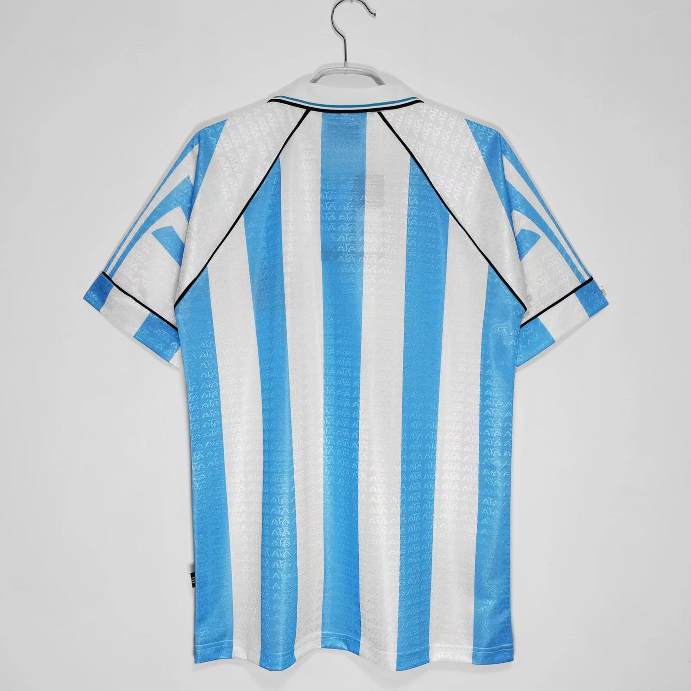 a blue and white striped shirt hanging on a hanger