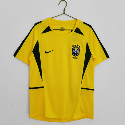 a yellow soccer jersey hanging on a hanger