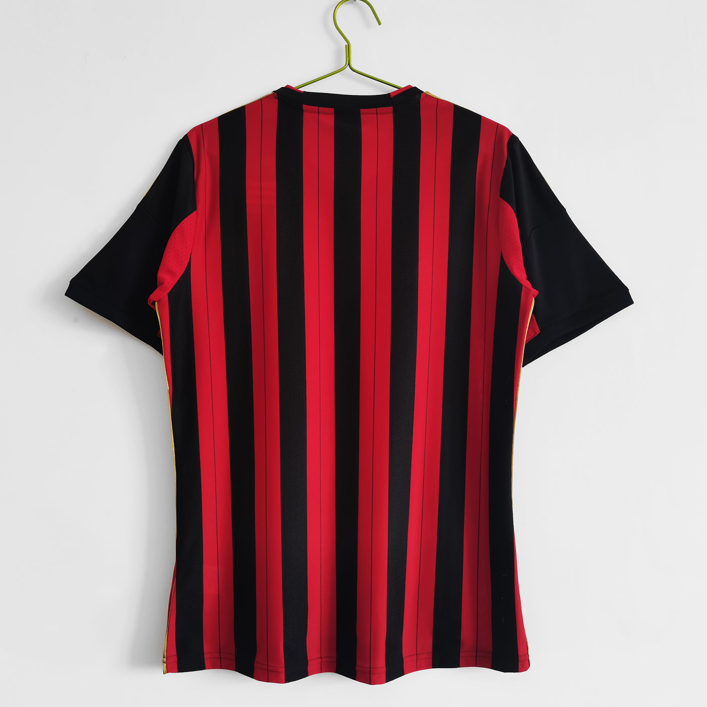 a black and red striped shirt hanging on a hanger