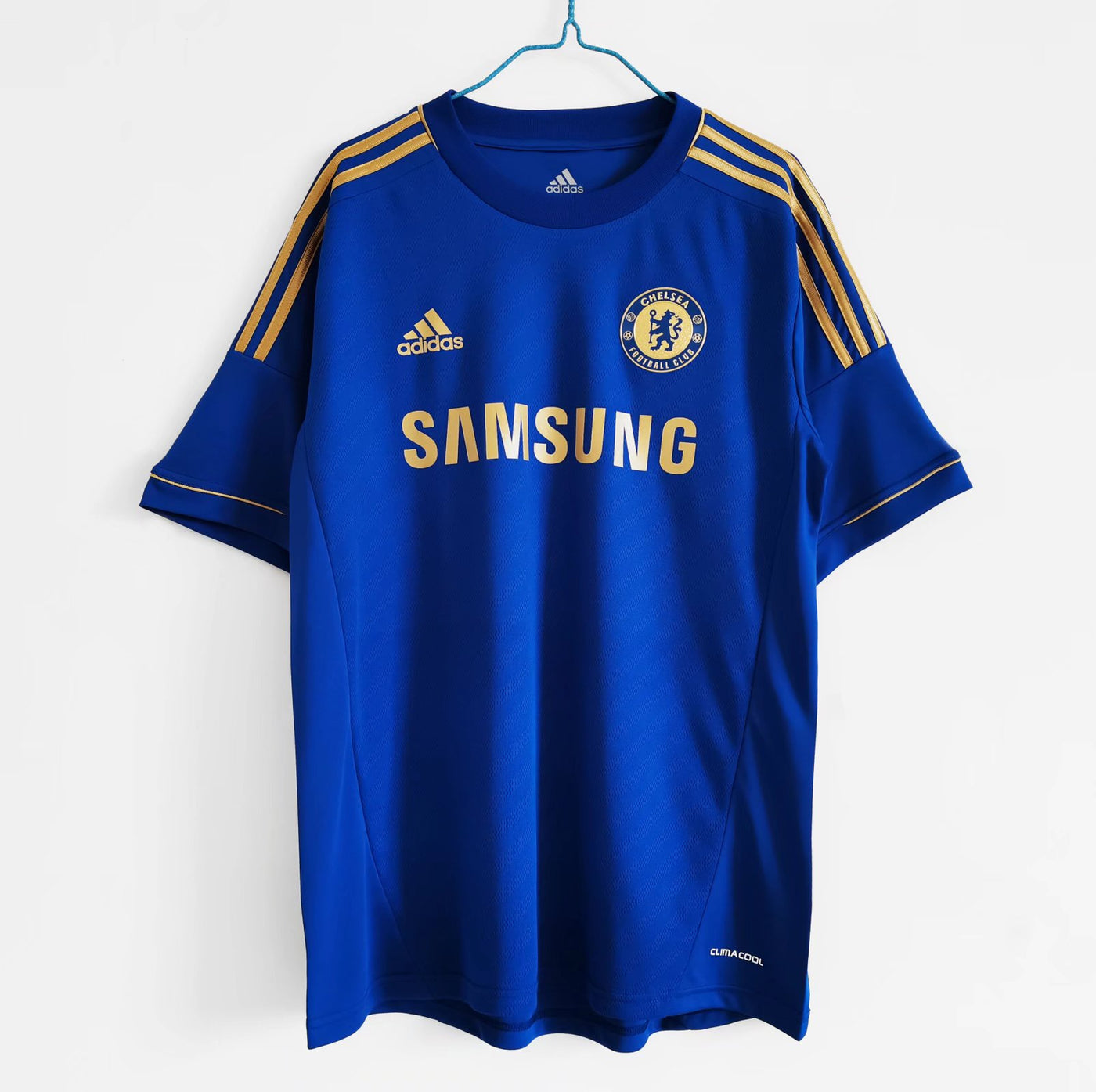 a soccer jersey hanging on a hanger