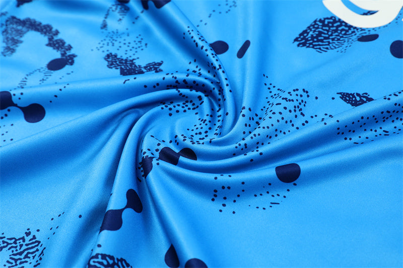 a blue fabric with black dots on it