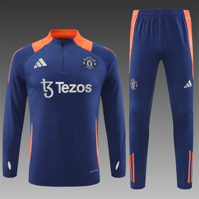 a blue soccer uniform with orange trims