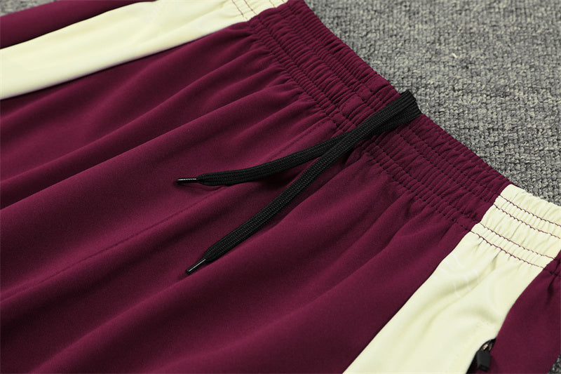 a close up of a maroon and white shorts