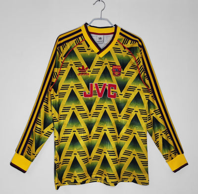 a yellow and black shirt with a red and yellow triangle pattern