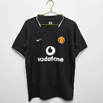 a soccer jersey hanging on a hanger