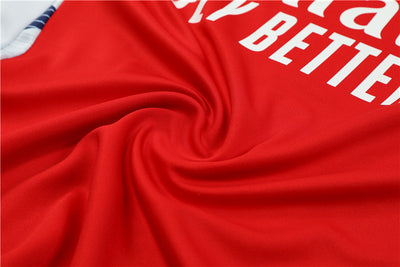 a red jersey with white letters on it