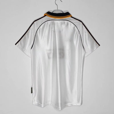 a white shirt hanging on a hanger