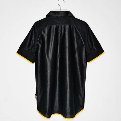 a black and yellow polo shirt hanging on a hanger