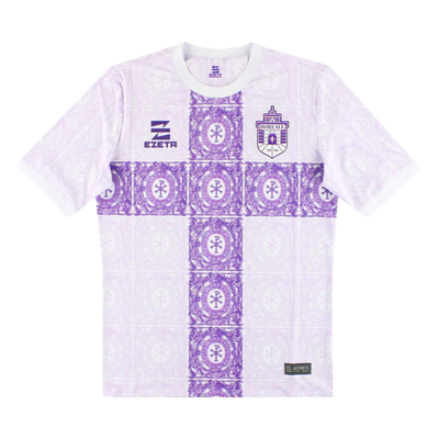 a purple and white t - shirt with a cross on it