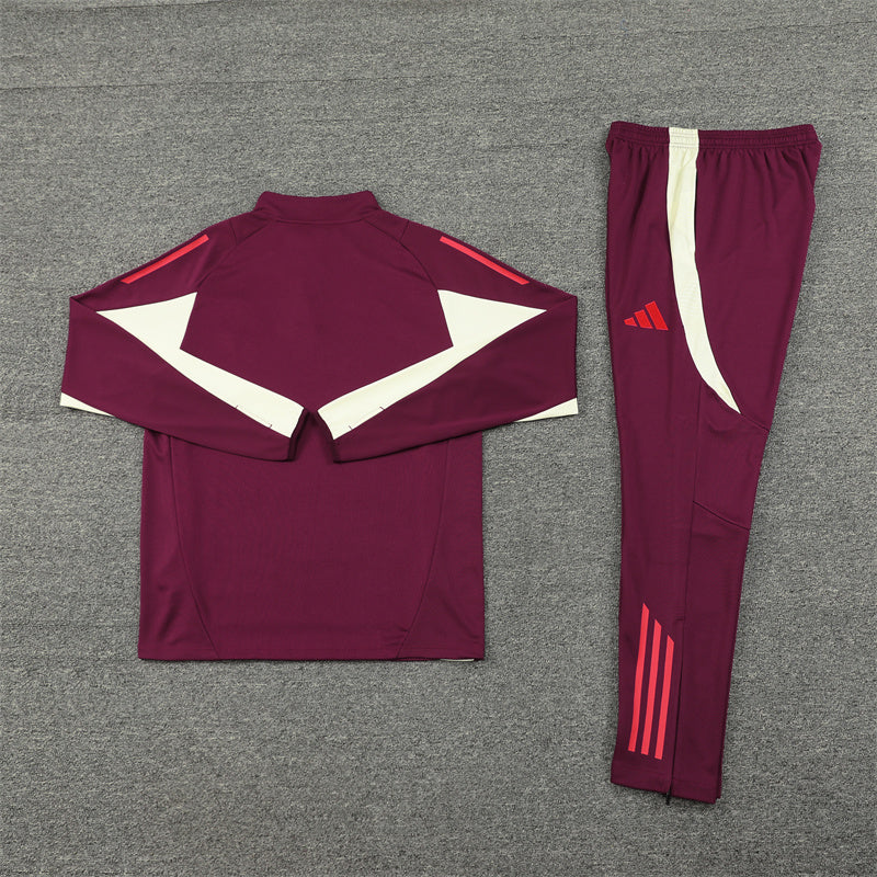 a maroon and white soccer uniform and pants