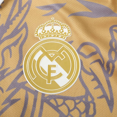 a close up of a soccer jersey with a crown on it