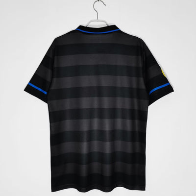 a black and blue striped shirt hanging on a hanger