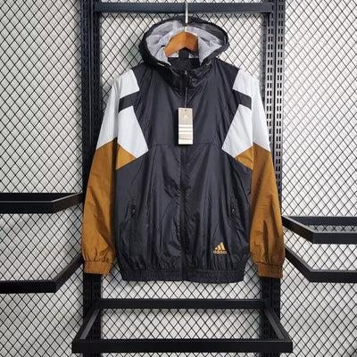 an adidas jacket hanging on a rack