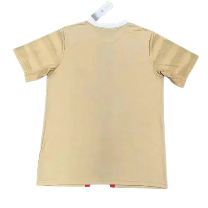 a tan t - shirt hanging on a clothes line