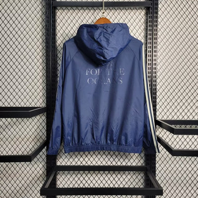 a blue jacket hanging up on a rack