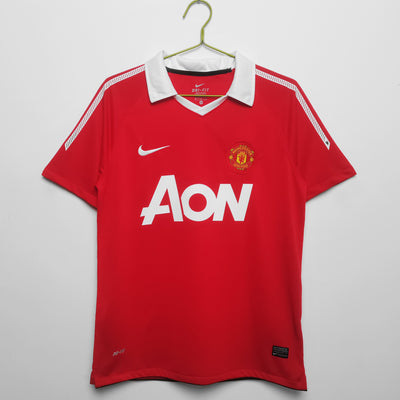 a manchester united shirt hanging on a hanger