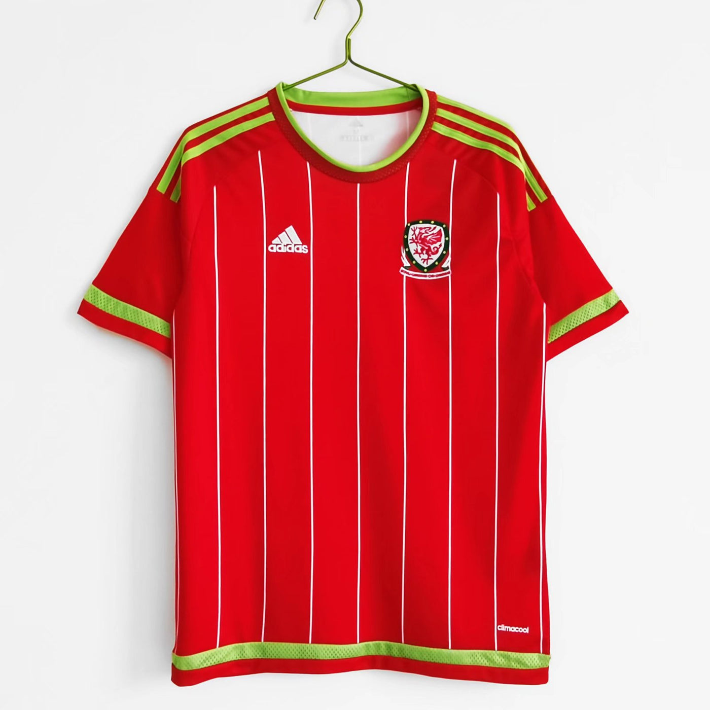 a red soccer jersey hanging on a hanger