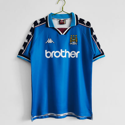 a soccer jersey hanging on a hanger