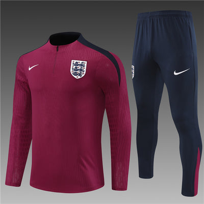 a red and blue soccer uniform with the england crest on it