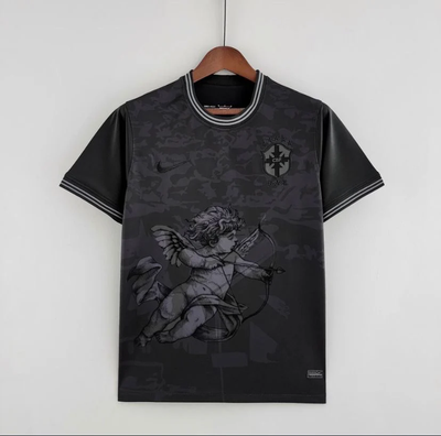 a black t - shirt with an angel on it