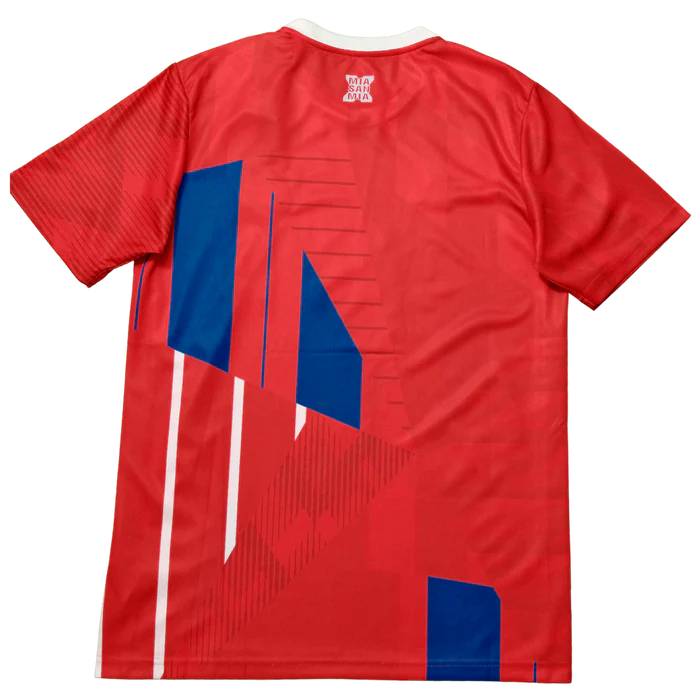 a red shirt with blue and white squares on it