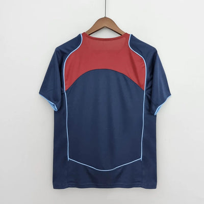 a blue and red shirt hanging on a hanger