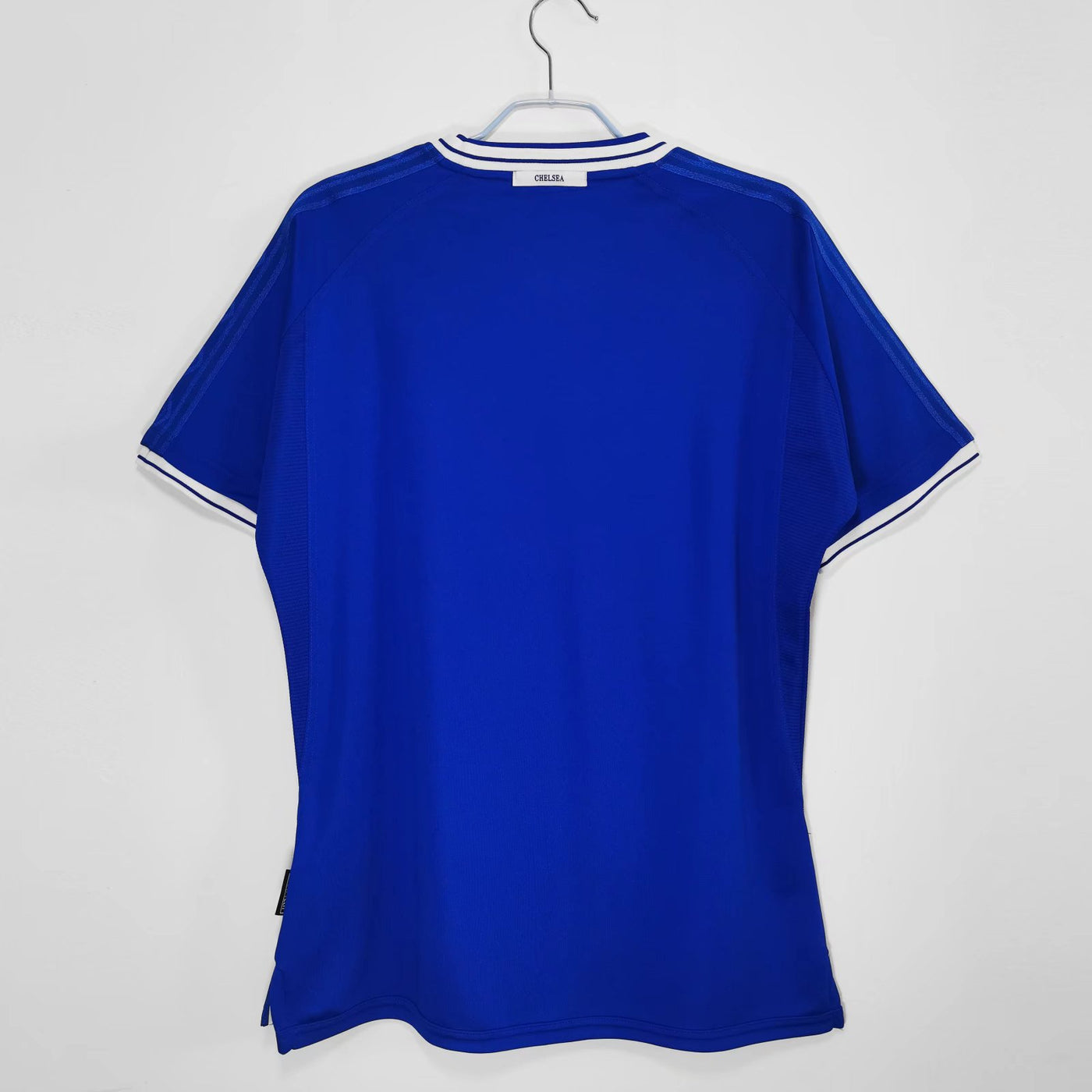 a blue shirt hanging on a hanger