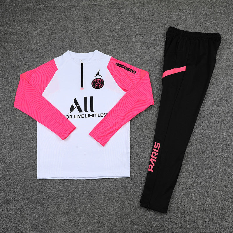 a white and pink shirt and black pants