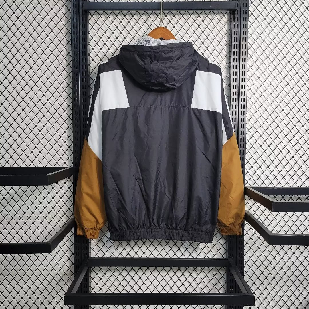 a jacket hanging on a rack in a room