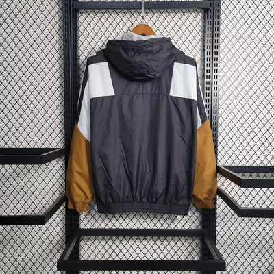 a jacket hanging on a rack in a room