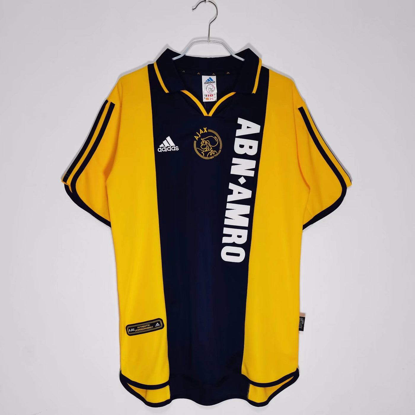 a soccer jersey hanging on a hanger