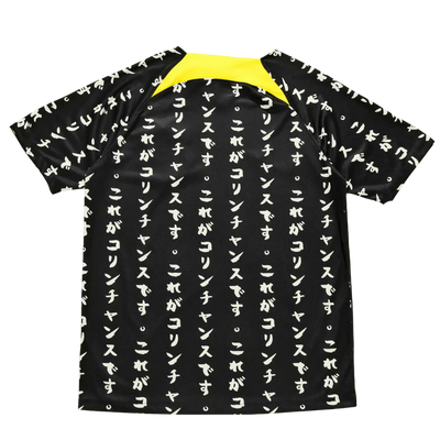 a black and yellow shirt with japanese writing on it